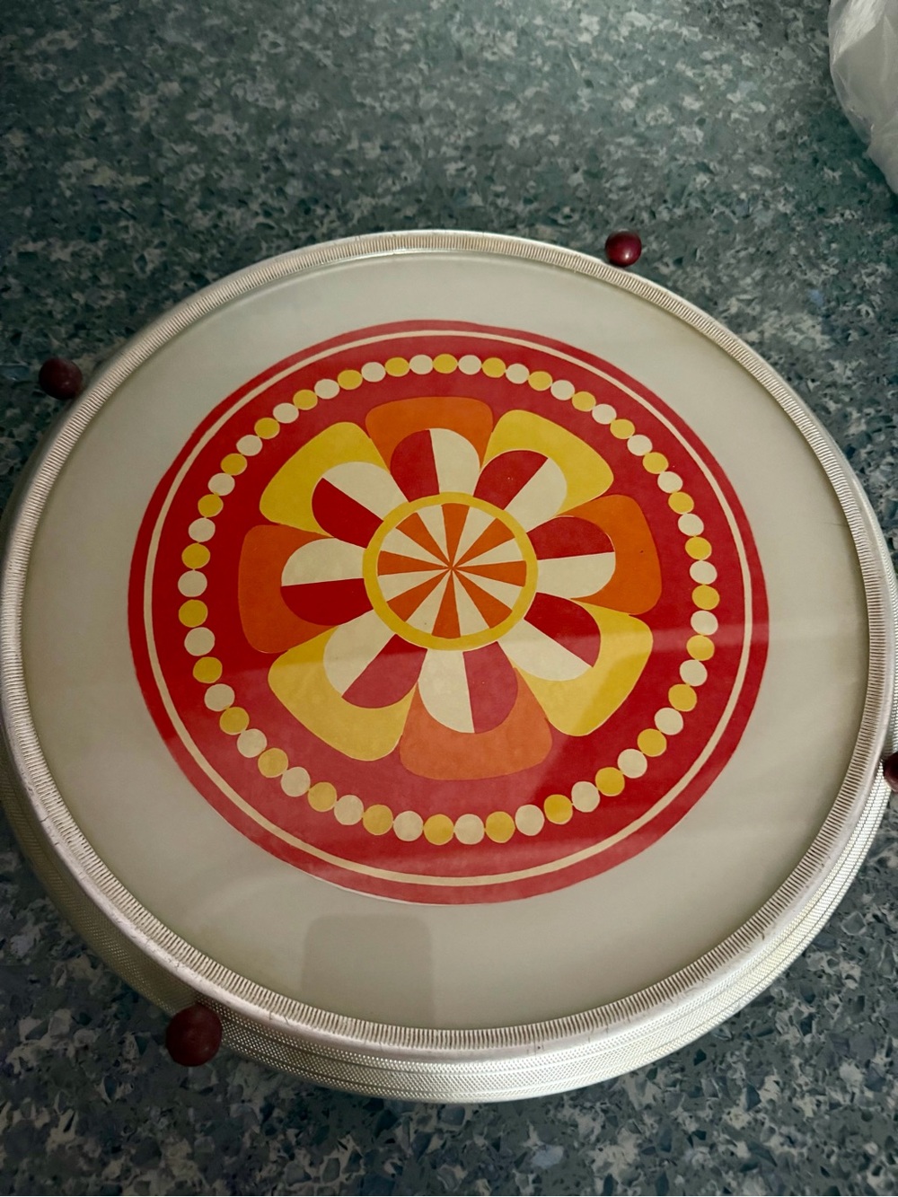 Vintage Rotating Cake Pastry Stand features a vibrant flower power pattern.  60s